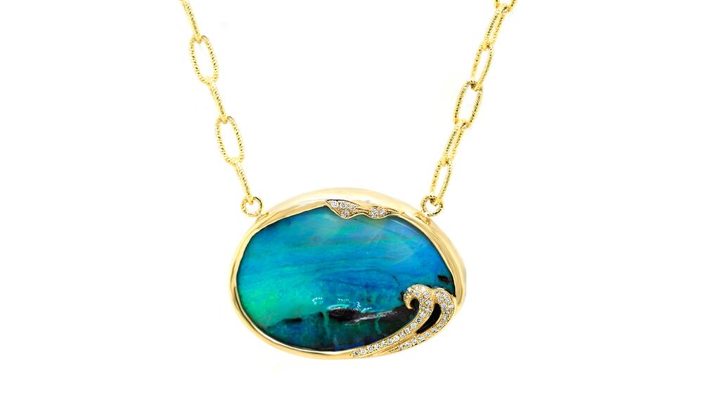 Avianti Jewelry Designs in La Cañada, California, designed by Ani and Avi Babayan. A 14-karat yellow gold necklace featuring a 78.67-carat Boulder opal with green-blue and black hues and 42 round pavé diamonds on an Italian paper clip chain ($4,980) Avianti Jewelry Designs Boulder opal necklace